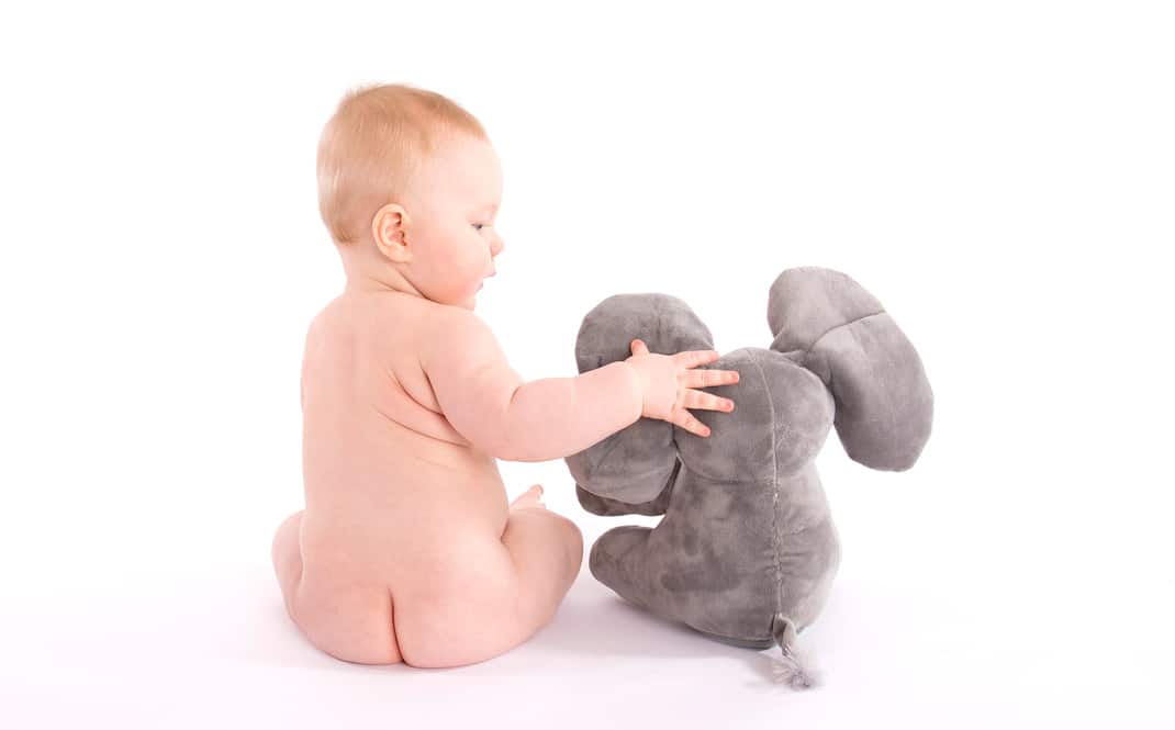 Baby and stuffed toy - baby photoshoot ideas